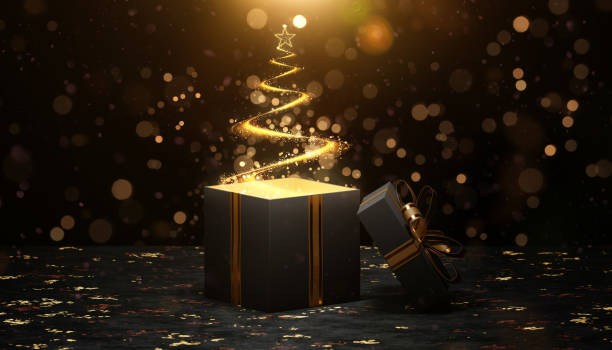 istock Christmas tree with star appearing from open gift box with gold ribbon 2186713246