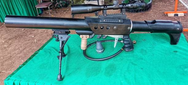 istock military big firearm gun displayed in green table 2186721359