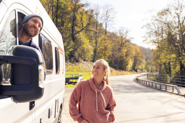 istock Couple Enjoying a Moment Near Their Camper Van 2186724177