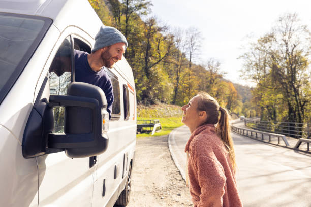 istock Couple Enjoying a Moment Near Their Camper Van 2186724182