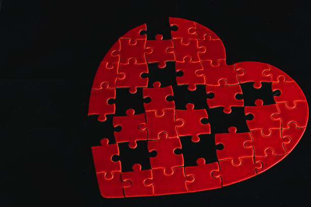 The concept of feelings in a puzzle. missing pieces in the puzzle, broken love High quality photo.