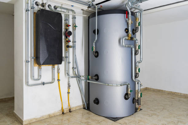 istock Modern Buffer Tank System Connected to Air-to-Water Heat Pump for Efficient Home Heating and Hot Water Storage in a Residential Setting 2186727406