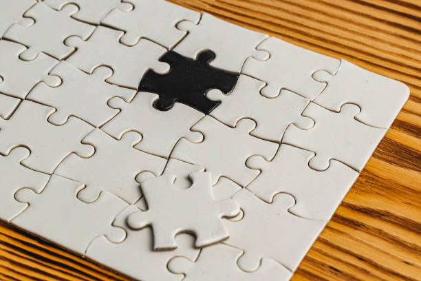 istock Choosing the correct option, against a black and white puzzle background 2186727565