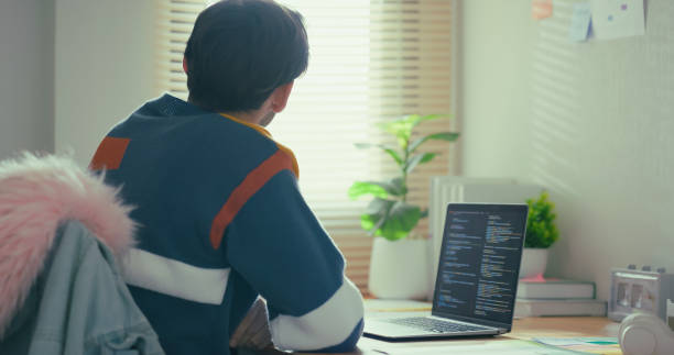 istock Caucasian Man Contemplating Thoughts While Working on Laptop at Home. 2186727811