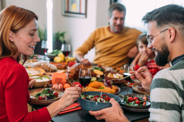 istock Happy extended family celebrating Christmas at dining table. 2186729121
