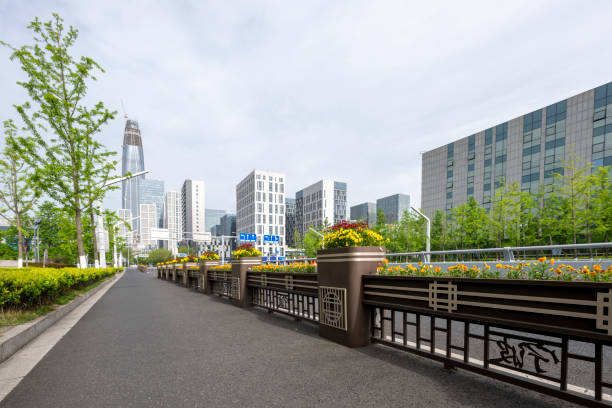 Urban buildings by the lake in the morning park in Ningbo, Zhejiang Province, China