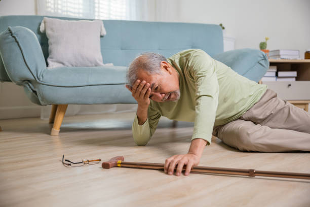 istock Sick senior old man falling down lying on floor because stumbled at home 2186733767