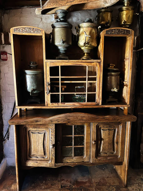 istock Antique samovars displayed on rustic wooden cabinet with vintage charm 2186734557
