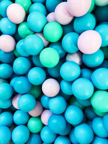 istock Colorful plastic balls in a vibrant playful background 2186734720