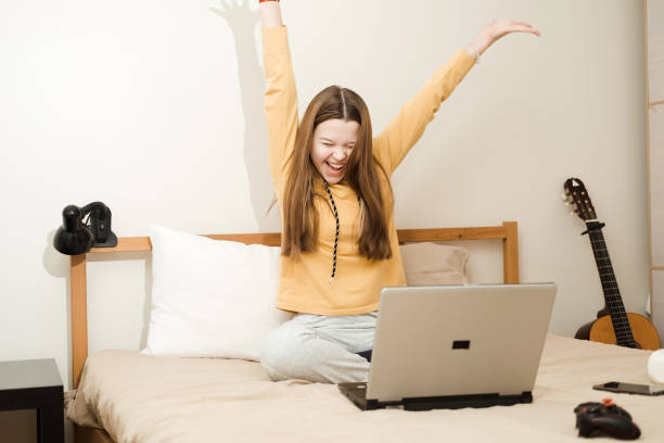 istock Young woman using computer laptop very happy and excited doing winner gesture with arms raised, smiling and screaming for success. 2186735006