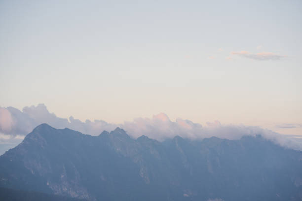 landscape and travel concept with sunlight and cloudy sky with mountain