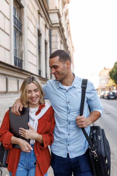 istock Young couple walking in the city 2186739710