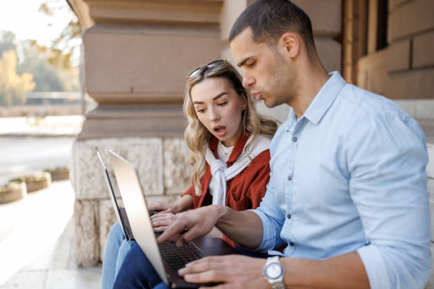 istock University students working on laptop after lessons 2186740178