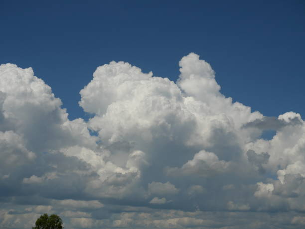 istock Cumulonimbus cloud formations on tropical sky 2186742403