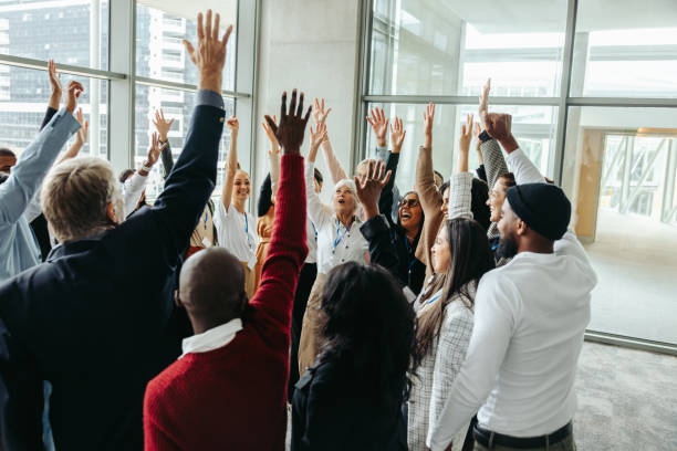 istock Successful team energizing at conference during a productive training day in a modern office environment with diverse coworkers 2186742731