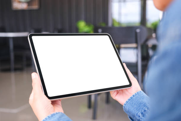 istock Mockup image of a woman holding digital tablet with blank desktop screen in cafe 2186745761