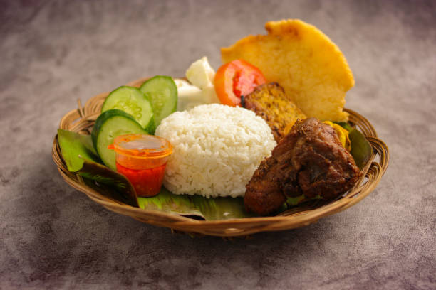 istock Indonesian Ayam Bakar with Rice, Tempeh, and Fresh Vegetables 2186745788