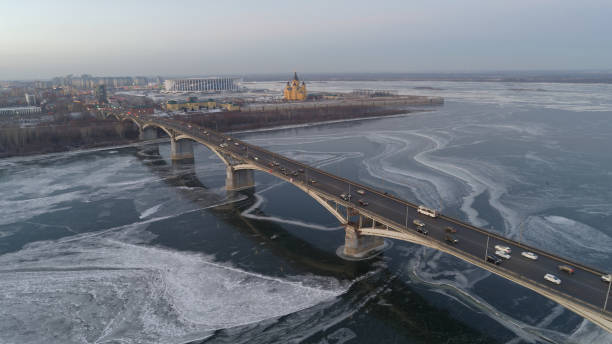 istock Bridge over a frozen river with cars driving on it 2186745873