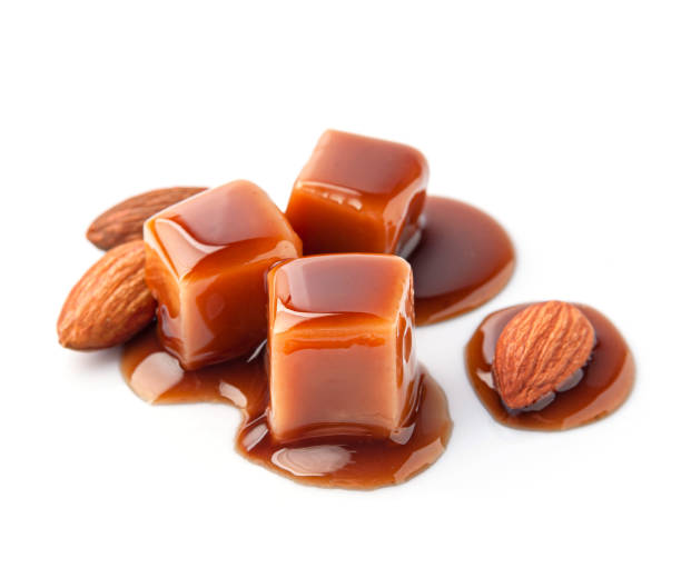 istock Caramel candy with caramel topping and almonds nuts 2186746642