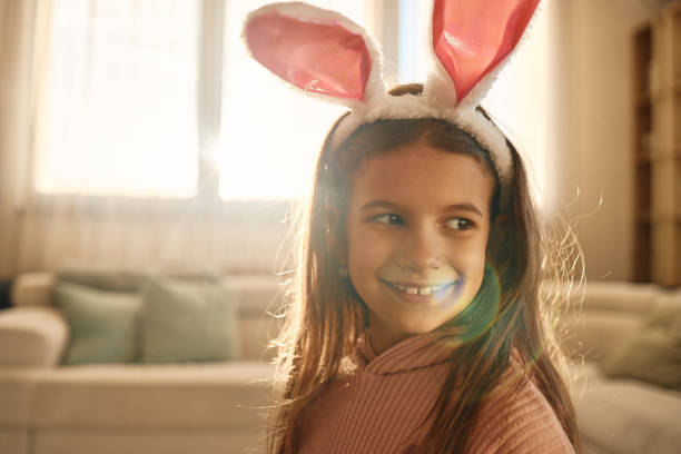 istock Cute girl wearing bunny ears 2186747313