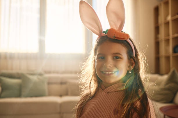 istock Cute girl wearing bunny ears 2186747441