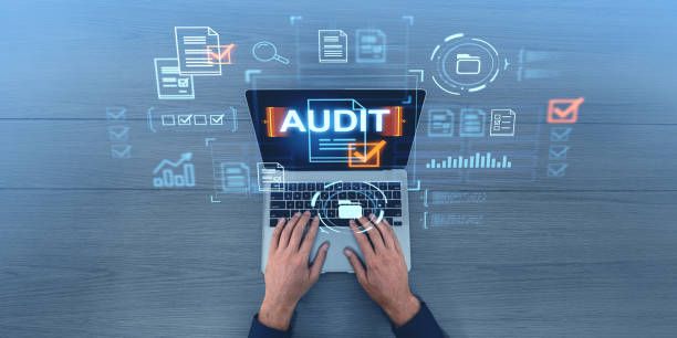 istock Hands typing on a laptop with audit icons and digital checklists, blue background, business audit concept, digital graphics overlay 2186748635