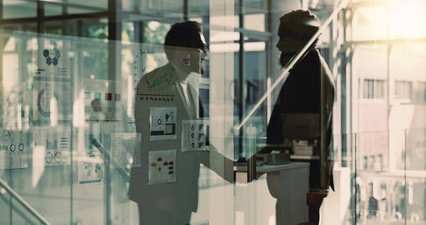 istock Business, men and handshake for meeting in office with partnership, introduction and interview success. Silhouette, people and agreement with promotion offer, onboarding greeting and b2b opportunity 2186750128