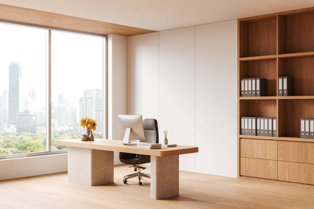 istock Beige business interior with ceo desk near panoramic window, pc and shelf 2186750190