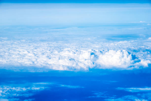 An abstract image of the sky with clouds taken from an airplane from a high angle.