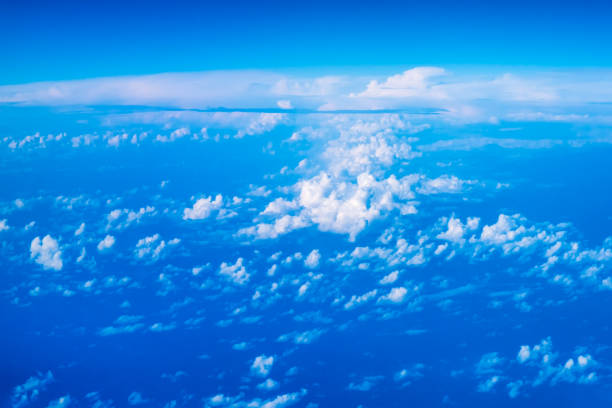 An abstract image of the sky with clouds taken from an airplane from a high angle.