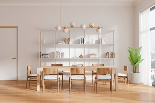 istock White home living room interior with table and seats, shelf and panoramic window 2186750912