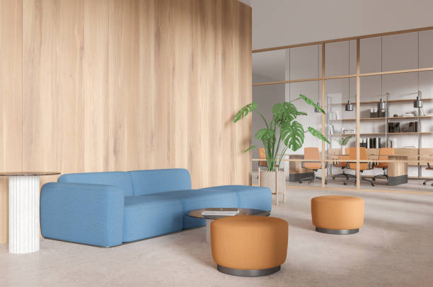 istock Wooden office interior with relaxing and meeting space, shelf with documents 2186751039
