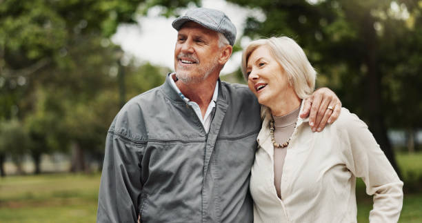 istock Park, senior couple and happy with hugging on walk routine for retirement, support and bonding. People, relationship and smile outdoor for break, care and love as pensioner for date 2186751185