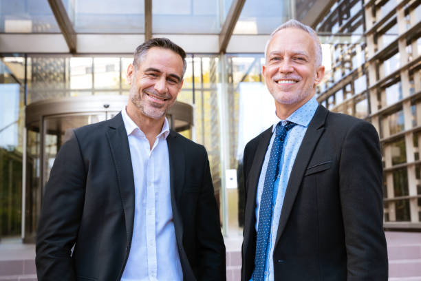 istock Confident Businessmen Posing on Office Staircase looking at camera 2186752139