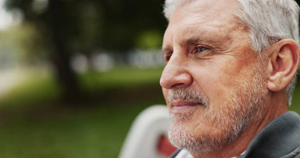 istock Mature man, thinking and outdoor in nature for memory, reflection or nostalgia with confidence. Male person, remember and relax on break or peace in park for calm, environment or fresh air on weekend 2186752441