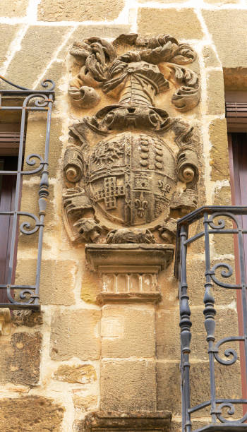 istock Old stone wall with a heraldry coat of arms as decoration 2186754052