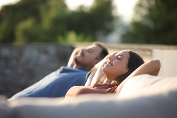 istock Couple resting and relaxing sitting in an exterior couch 2186755857