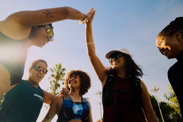 istock Group of gen z runners giving high five after workout 2186756178