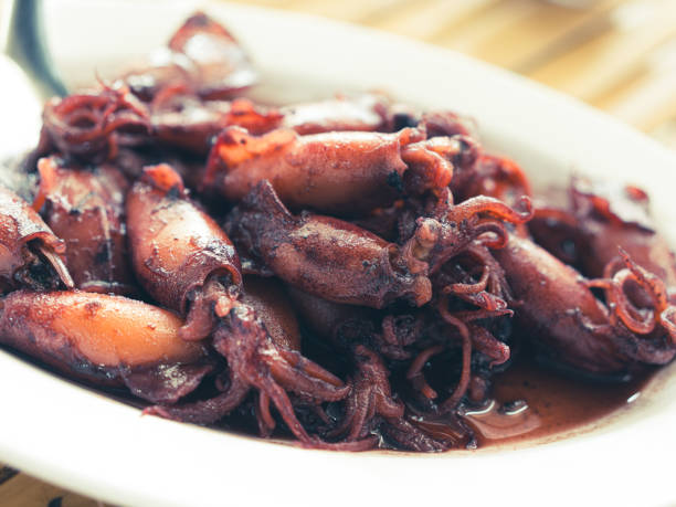 istock Sauteed black squid is processed squid that is cooked until the squid ink is released. The resulting taste is very distinctive. 2186756238