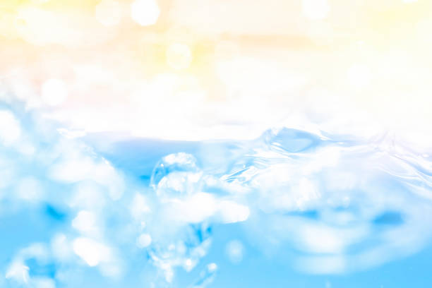 Empty background with bubbles in slight blur at high magnification. Background with close-up of drinking water in soft focus.