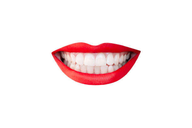 istock Woman's smiling mouth with red lips and even teeth isolated on a white background 2186758088