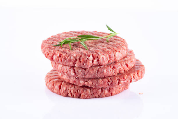 istock Isolated raw hamburger patty on white background. 2186759534