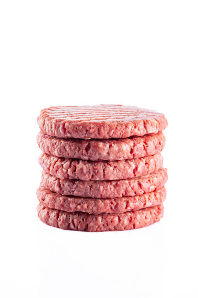 istock Isolated raw hamburger patty on white background. 2186759544