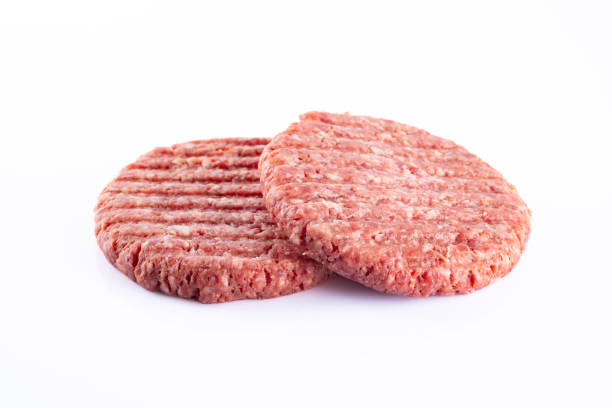 istock Isolated raw hamburger patty on white background. 2186759557