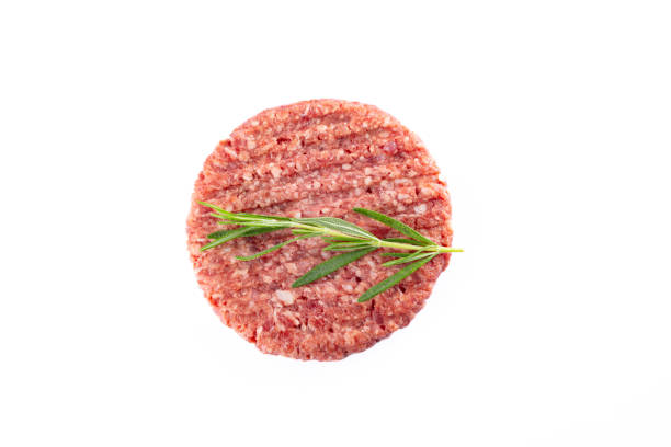 istock Isolated raw hamburger patty on white background. 2186759574