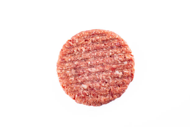 istock Isolated raw hamburger patty on white background. 2186759579