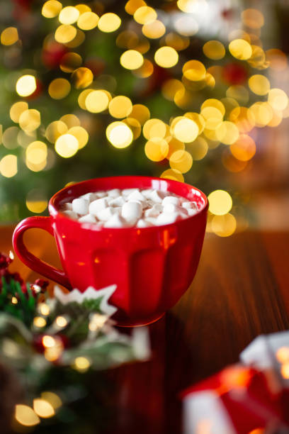 istock Hot chocolate with marshmallow over Christmas tree background 2186764251