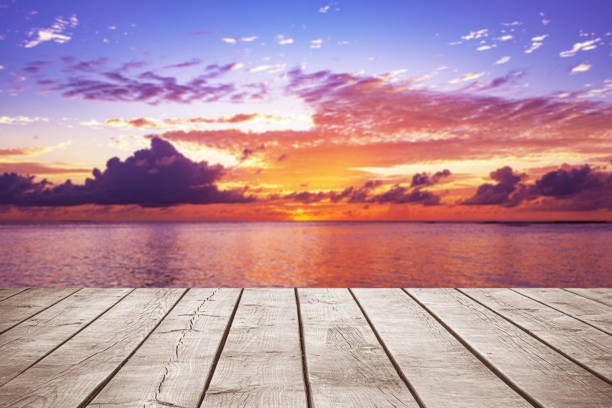 istock Empty wooden table top with tropical ocean sunset background 2186765210