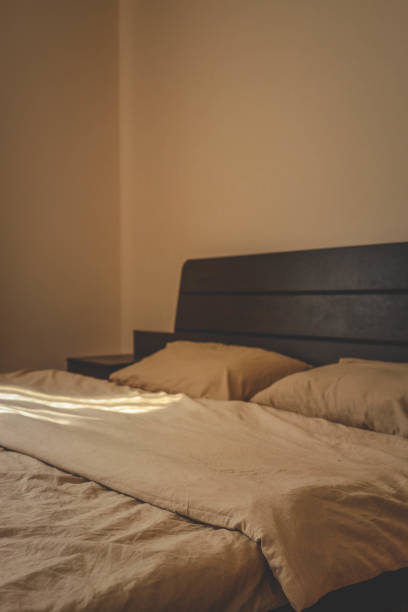 istock Cozy beige bedding on the bed 2186765305