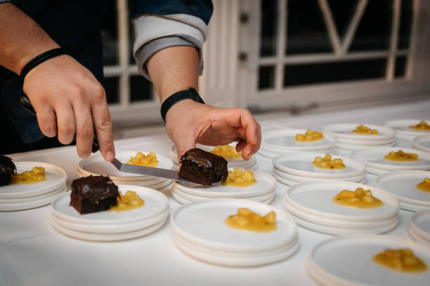istock Chef Plating Chocolate Dessert With Apple Compote In Restaurant Kitchen 2186768278
